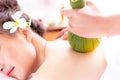 Expert or professional of massage of aromatherapy is using herbal ball for rejuvenating or massaging a beautiful
